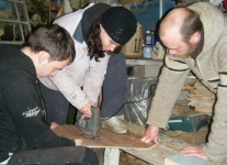 Cathal, Marianne and Brian jigsaw the pywood down to deck shape. Photo: SR